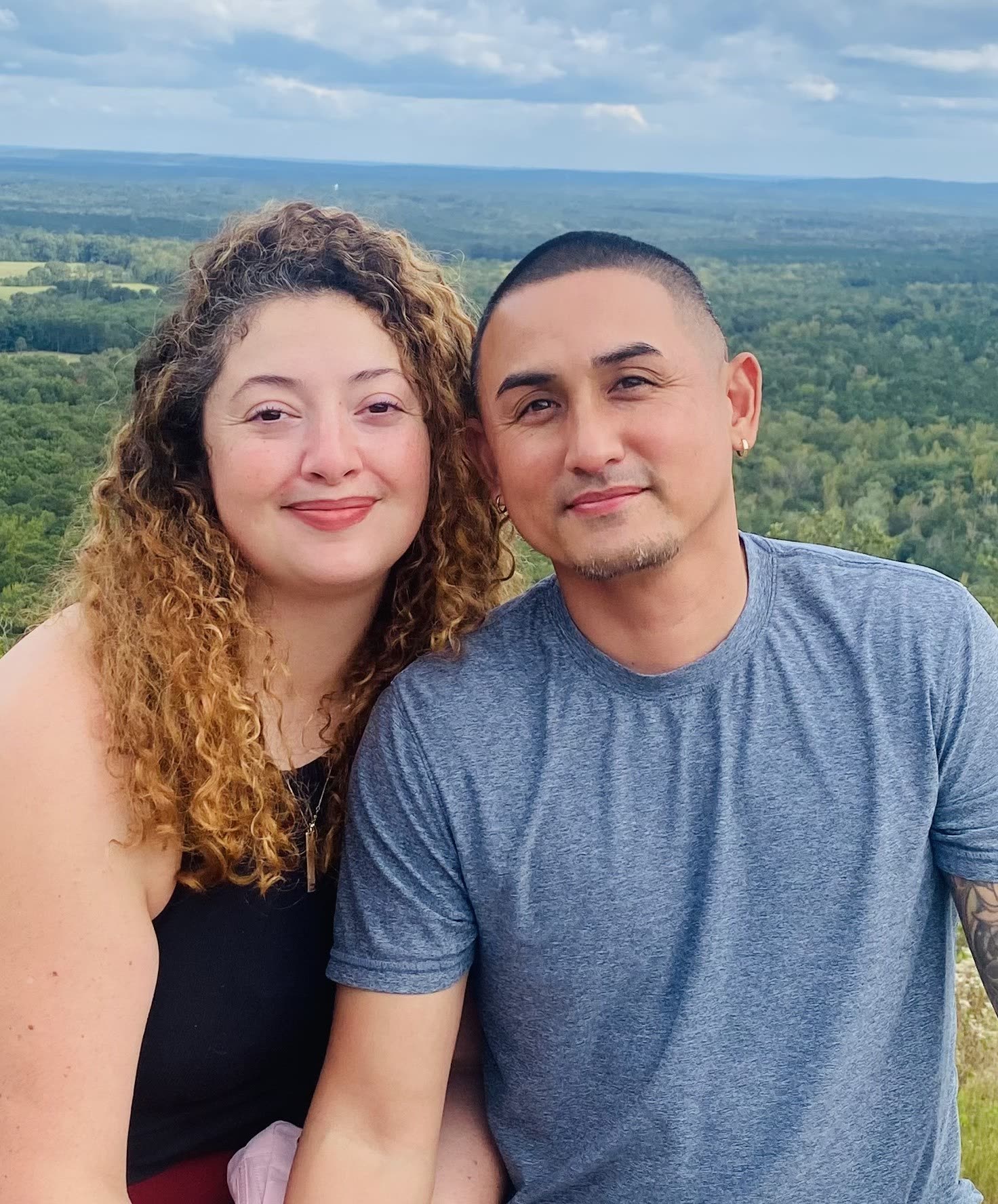Michael, founder of Bag Chasers Laundry Co., with his wife on a ridge overlooking north Georgia