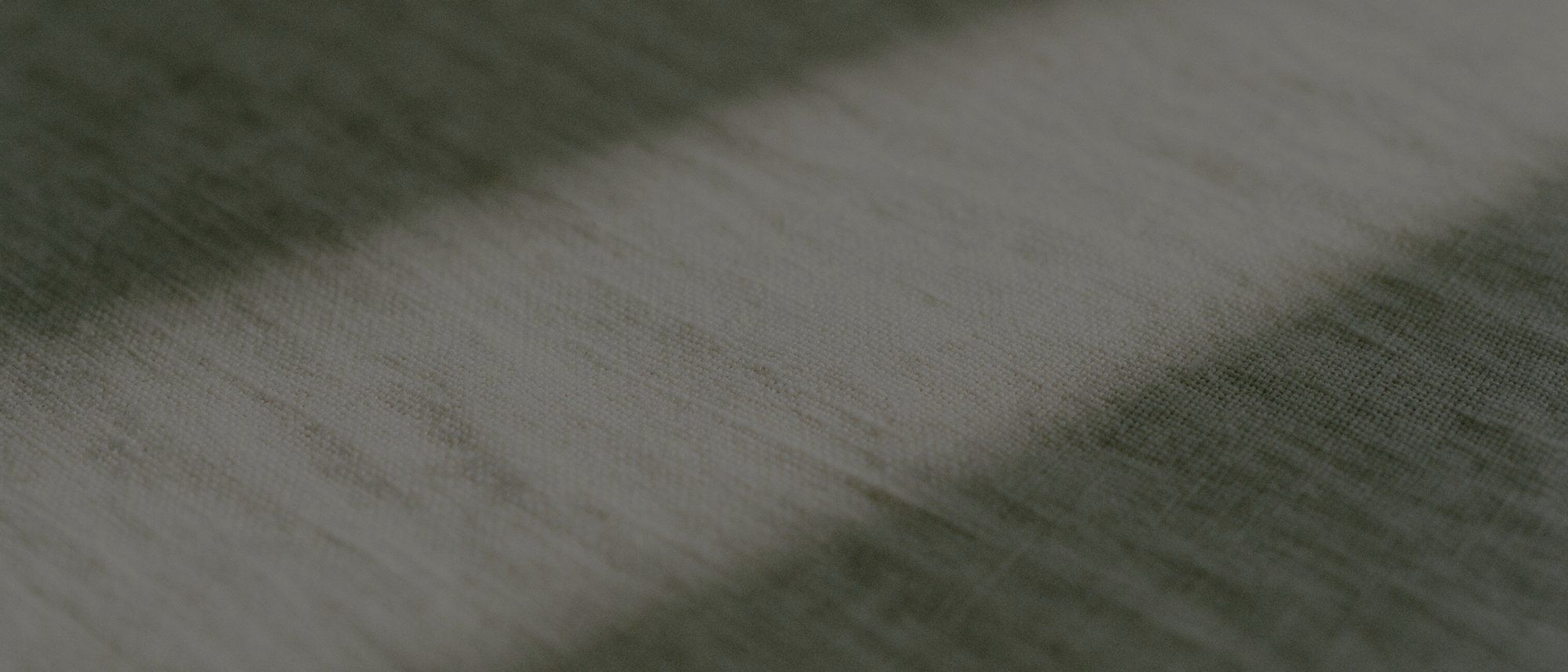 Crisp white cotton linen, lit from one side